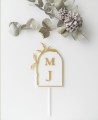 Vue de dessus : cake topper décoré d’olivier