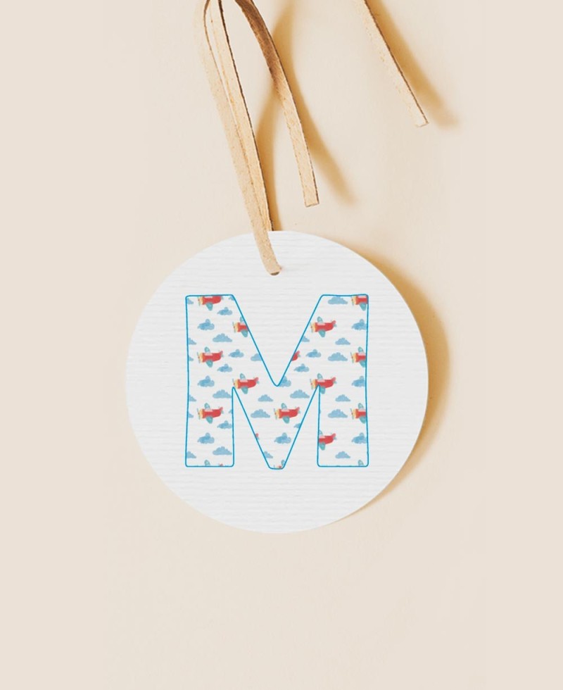 Round label for initial baptism details sky