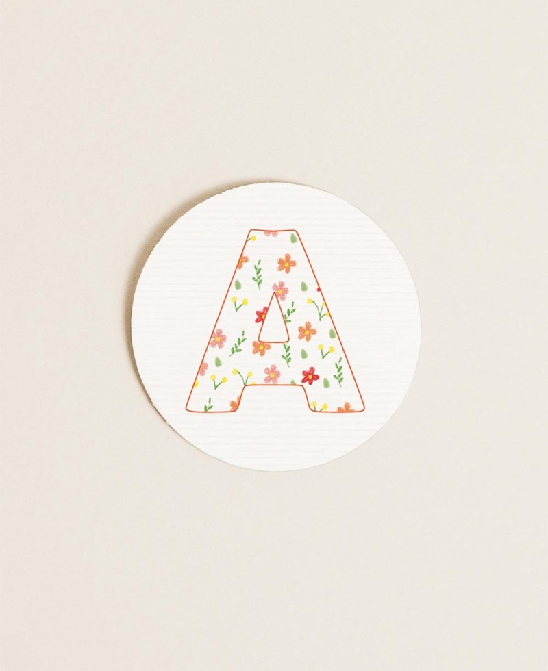 Round labels for initial baptism details, flowers, colors