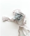 Jar of dried flowers in powdery blue color