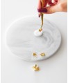 Placing silver flakes on hot wax